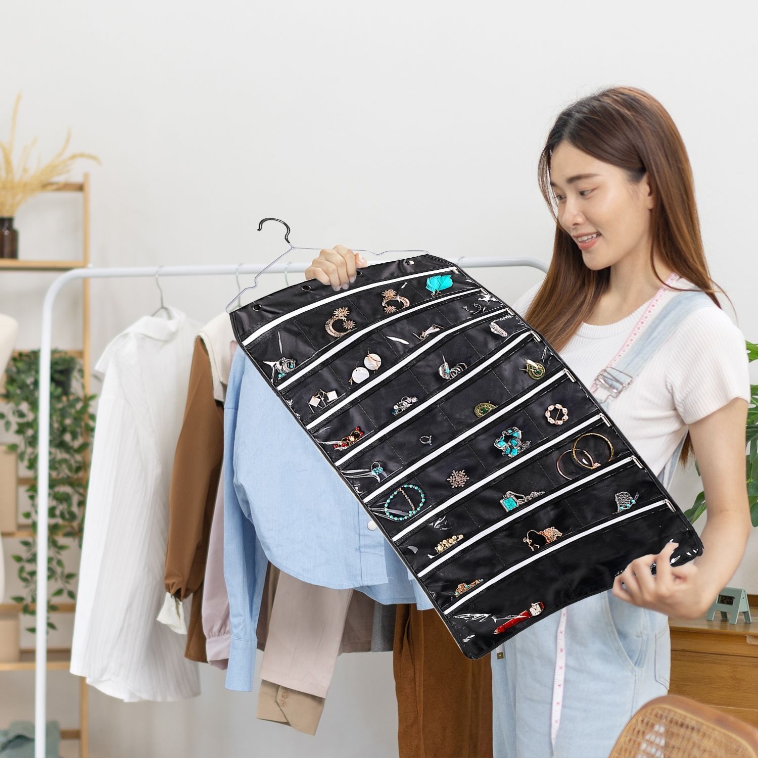 Dual-Sided Versatility: Our hanging jewelry storage organizer features 28 transparent zippered compartments on each side, totaling 56. This hanging jewelry organizer for closet is perfect for organizing jewelry, earrings, rings, watches, and small accessories